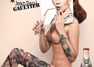 Designer Jean Paul Gaultier has joined forces with Coca-Cola to become the latest member of the body art brigade