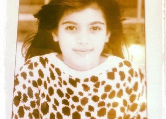 Kim Kardashian tweeted a picture of herself aged 7 that is displayed in her grandmother's children's clothing boutique in San Diego