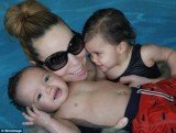 Mariah Carey had one arm wrapped around daughter Monroe while the other held onto Moroccan, who was floating in the water