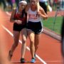 Meghan Vogel helps collapsed competitor cross the finish line at 3200-metre finals in Columbus