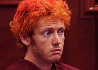 James Holmes, the suspect gunman at Aurora cinema, has been formally charged with 142 criminal counts in one of America's worst mass shootings