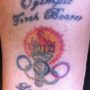 Olympics 2012: torchbearer Jerri Peterson discovers spelling error in her Olympic tattoo