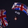 Queen Elizabeth II “drops in” to Olympic Stadium by parachute accompanied by James Bond