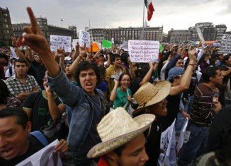 Tens of thousands of people in Mexico City are marching against the result of the presidential election, which was won by Enrique Pena Nieto