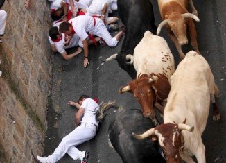 This year's Pamplona bull running festival kicked off today with one thrill-seeker was gored in a leg and four others injured