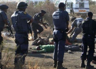 At least 30 people have been killed after South African police clashed with striking miners at Lonmin Marikana mine on Thursday