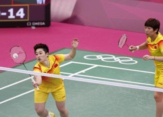Chinese Olympic delegation has begun an investigation into allegations two badminton players "deliberately lost" their match