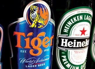 Heineken has agreed to buy Fraser and Neave's controlling stake in the maker of Tiger beer in a deal worth 5.6 billion Singapore dollars