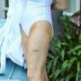 Lindsay Lohan shows off her blotchy fake tan at the pool