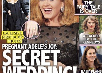 Pregnant Adele sporting a gold band on her ring finger