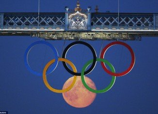Reuters photographer Luke MacGregor’s perfectly timed snap captured the full moon forming a sixth ring in the Olympic display on London's Tower Bridge