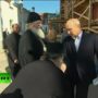 Vladimir Putin’s hand kissed by Russian Orthodox priest