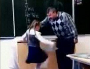 A Russian little girl cracks after receiving a lengthy telling-off by her bullying teacher and gives him a powerful kick in the groin