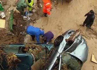 At least seven people have died after heavy rains triggered flash floods in southern Spain