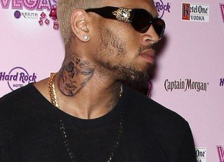 Chris Brown unveils new tattoo of a woman's battered and bruised face