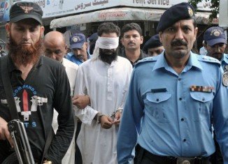 Imam Khalid Chishti has been remanded in custody, accused of planting pages of the Koran among burnt pages in the bag of a Christian girl held for blasphemy