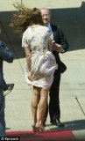 Kate Middleton was almost left red-faced at Brisbane Airport when a gust of wind threatened to play havoc with her summery dress