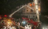 More than 200 people are now known to have died in a fire at a garment factory in Karachi