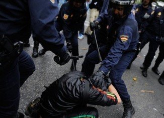 Police have fired rubber bullets and baton-charged Spanish protesters attending Occupy Congress rally against austerity in Madrid