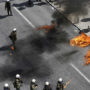 Greece: police fire tear gas and arrest dozens of protesters during one-day strike in Athens