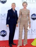 Portia de Rossi opted for something more masculine, posing with wife Ellen DeGeneres in an unusual Maison Valentino jumpsuit
