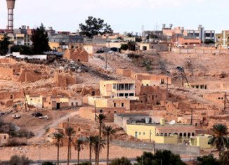 At least 22 people have died in days of fighting in Libya's town of Bani Walid