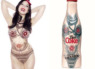 Daisy Lowe flaunts her enviable curves while bringing to life Jean Paul Gaultier’s tattoo bottle design for Diet Coke