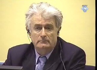 Former Bosnian Serb leader Radovan Karadzic has begun his defence at his war crimes trial