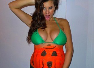 Imogen Thomas celebrates Halloween by turning her baby bump into a pumpkin