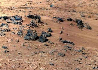 NASA’s Curiosity rover is preparing to scoop its first sample of Martian soil