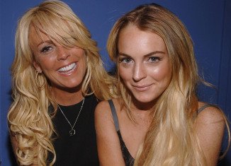 Police were called after Lindsay Lohan got into a “violent fight” with her mother Dina