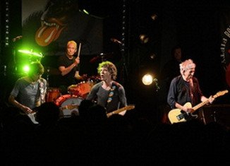 The Rolling Stones have performed to 350 fans at Le Trabendo club in Paris after announcing a surprise gig on Twitter