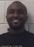 A newly-released booking photo of Nick Gordon shows him smiling following his arrest for reckless driving