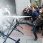 EU Parliament sprayed with milk by farmers protesting at falling dairy prices