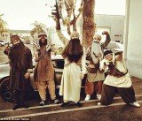 Chris Brown dressed as gun toting Taliban terrorist at Halloween party