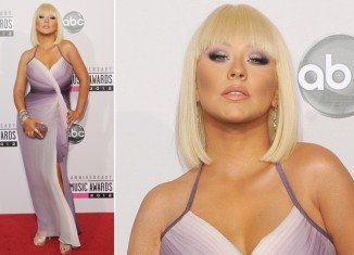 Christina Aguilera burst onto the AMA's on Sunday evening showing an unapologetic air of defiance to the skinny as she embraced her fuller figure