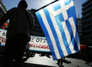 Greek parliament has narrowly backed a fresh round of austerity measures, despite violent protests across the country