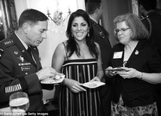Jill Kelley with General David Petraeus and his wife Holly at her home in 2011