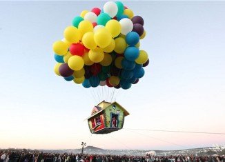 Jonathan Trappe, a cluster-balloonist who became the first person to fly the English Channel, has launched a house into the sky just like in the Disney movie Up