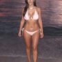Kim Kardashian displays her fake tan in pink string bikini on Miami Beach