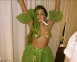 Lady Gaga shows her breast in marijuana plant costume at Halloween party