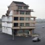 Building stands in the middle of highway in China as Luo Baogen refuses to move