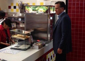 Mitt Romney was spotted picking up a snack in a McDonald's restaurant just ahead of a lunch in the White House with Barack Obama on Thursday