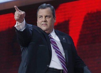 New Jersey Governor Chris Christie said he would stick with his Republican ticket and vote for Mitt Romney