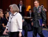 Paula Broadwell was caught gazing at David Petraeus as he entered a congressional hearing with his wife Holly in a photograph from 2011