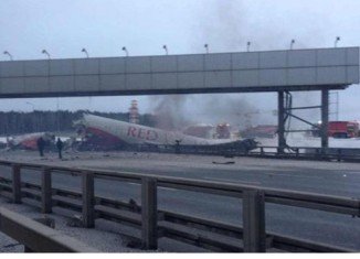 A Russian passenger plane has crashed into a main road outside Moscow, killing at least four people