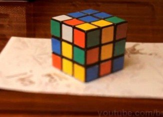 A new video on YouTube shows how what appears to be a fully formed Rubik's cube is in fact a two dimensional color drawing that tricks the brain into believing it has three dimensions