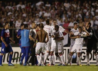 Argentine football club Tigre has accused Brazilian security officials of beating and pulling guns on its players during the half-time interval of Copa Sudamericana final with Sao Paolo