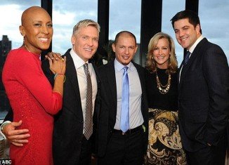 Cancer survivor Robin Roberts attended an intimate wedding for ABC News weatherman Sam Champion and his partner Rubem Robierb on Friday