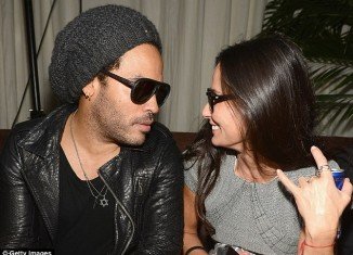 Demi Moore was seen exhibiting some very bizarre behavior at a Chanel party with Lenny Kravitz on Wednesday night